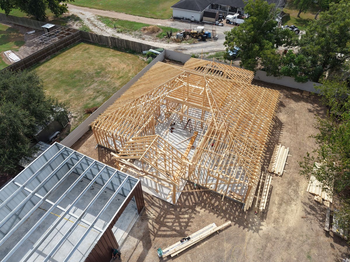 Aerial view of a wood-framed building next to a steel-framed structure