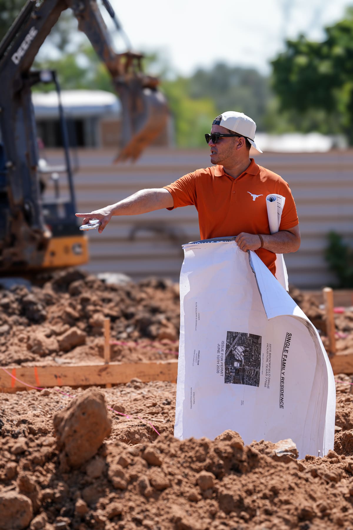 Directing site work with the plans in hand during excavation for a new home