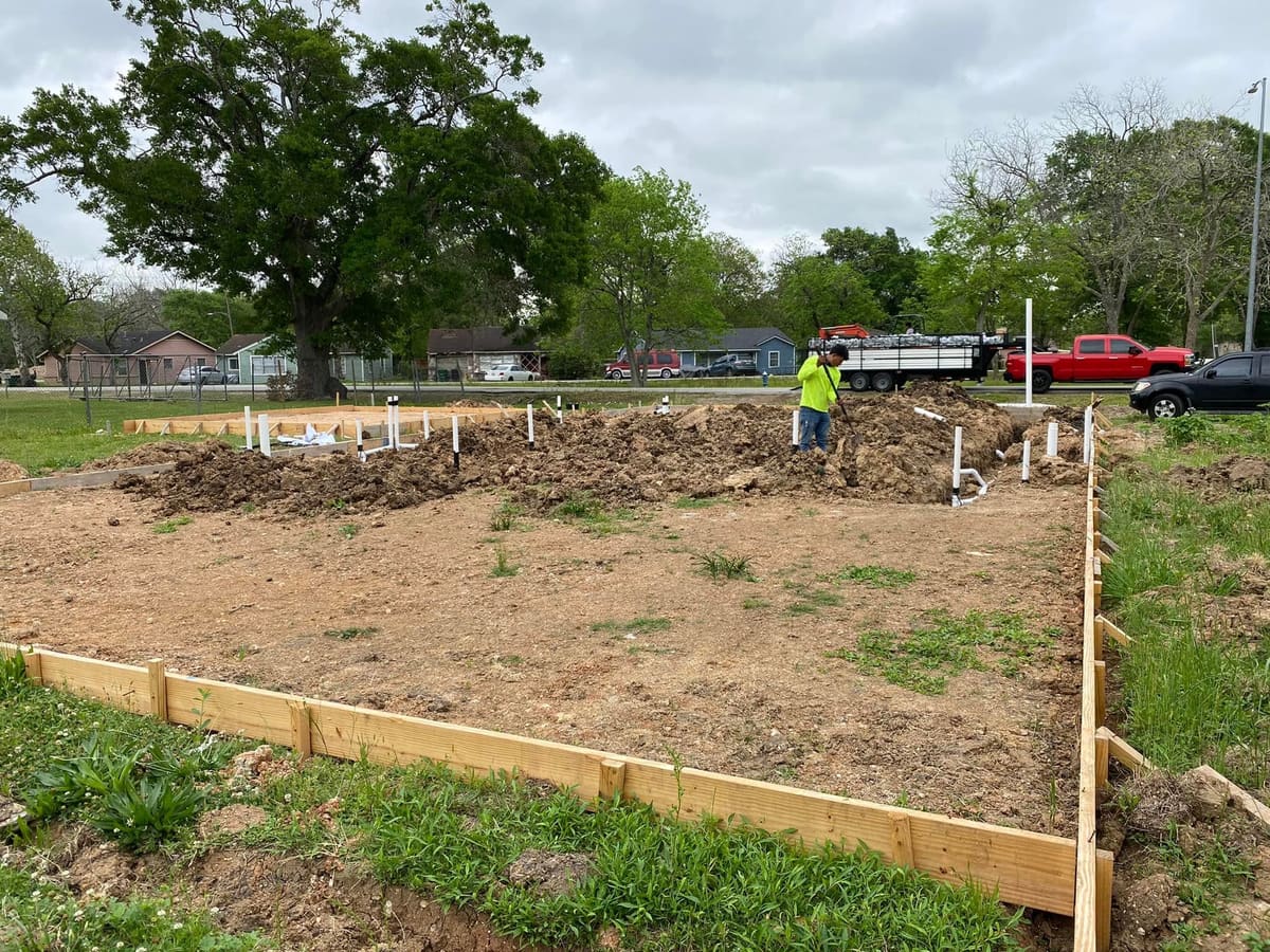 Foundation forms and plumbing set on a new home site