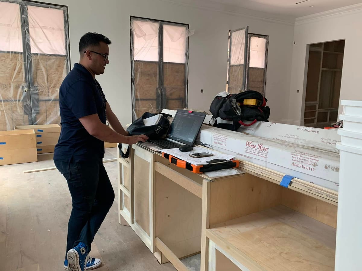 Project lead coordinating interior finish work on site