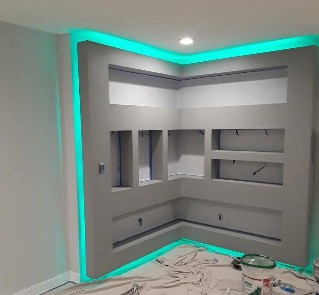 Built-in media wall with niches and accent lighting