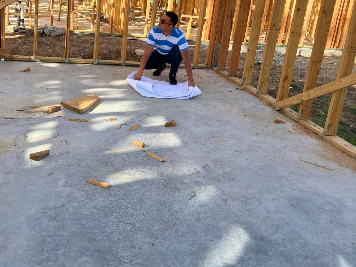Reading the plans on a new slab inside the wall framing