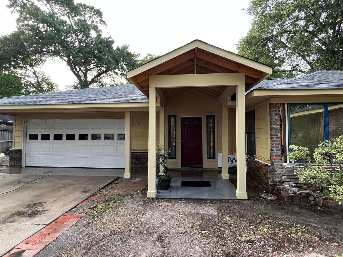 Finished gable porch addition with columns and a cedar ceiling